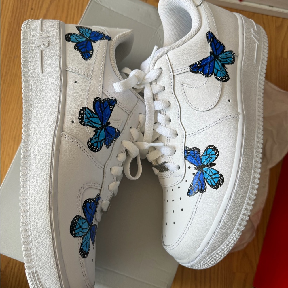 Nike White Leather Sneakers with Blue Butterfly Accents
